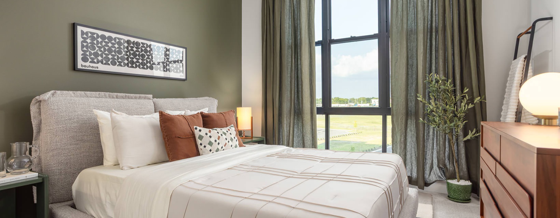 furnished bedroom with property views