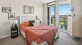 Bedroom with natural lighting and high ceilings